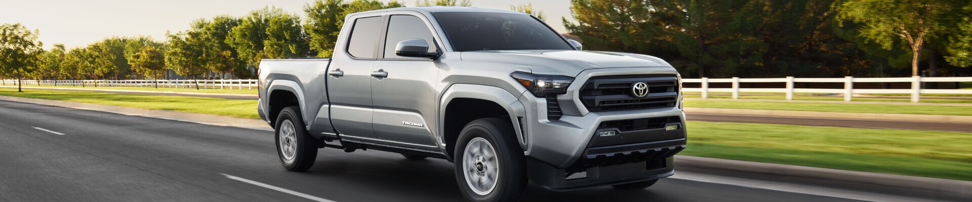 2025 Toyota Tacoma SR5 driving on the highway on a clear day
