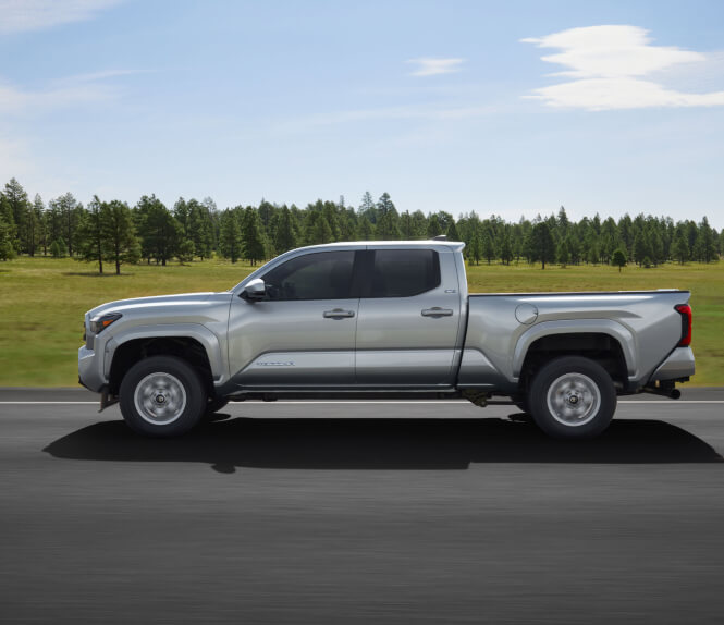 2024 Toyota Tacoma SR5 parked in front of an open field