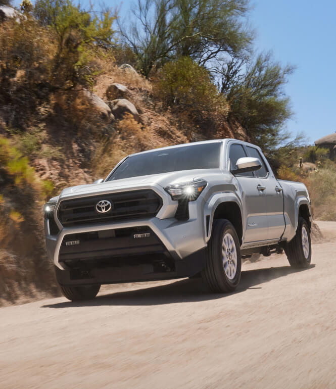 2024 Toyota TacomaSR5 parked in desert-like terrain