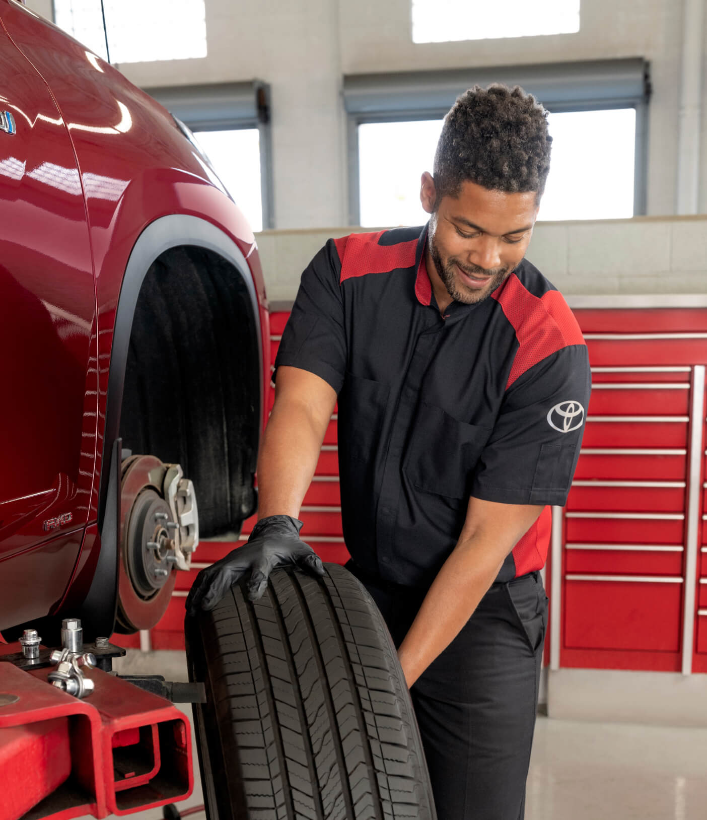 Wheel rotation being completed by a certified Toyota auto technician