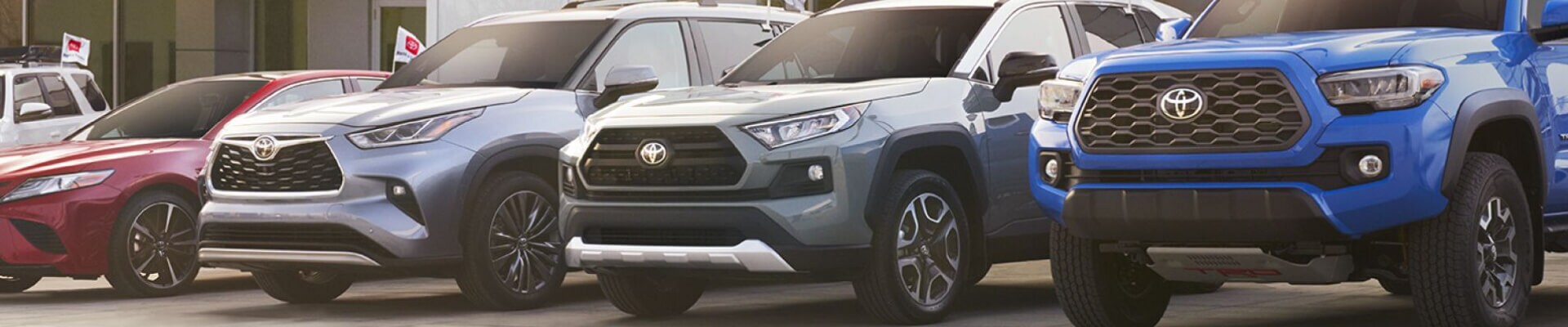 Toyota Vehicles lined up outside of Toyota dealership