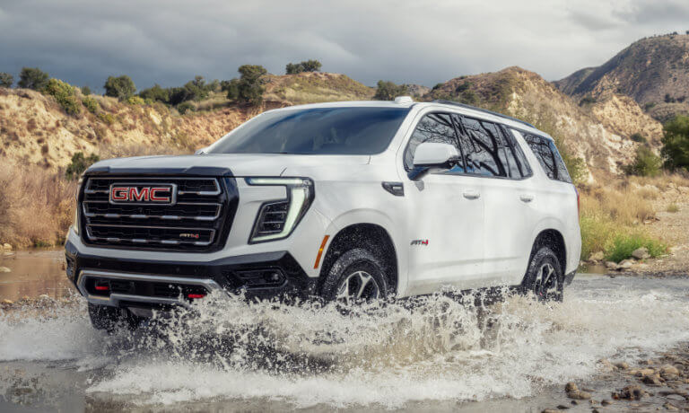 2025 GMC Yukon Exterior Driving Through Stream