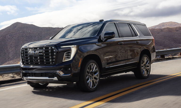 2025 GMC Yukon Exterior Driving On Mountain Curve