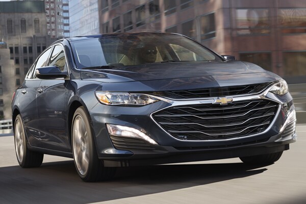 2010 Chevy Malibu driving down the street