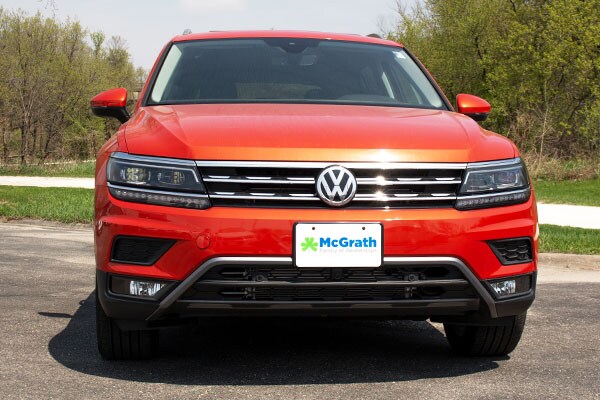2019 Metallic Orange VW Tiguan driving in the mountains