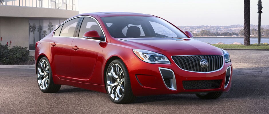 Red 2016 Buick Regal next to the Ocean