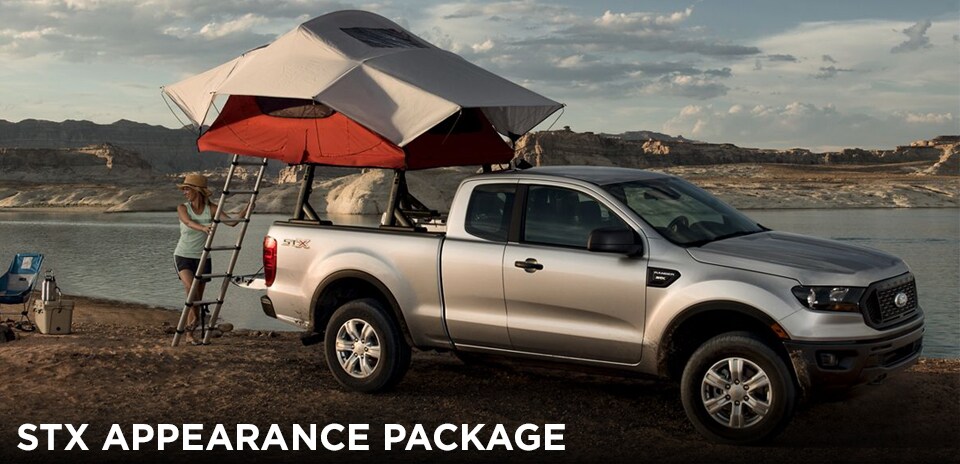 2019 Magnetic Ford Ranger STX Appearance Package with tent propped up on a river bank