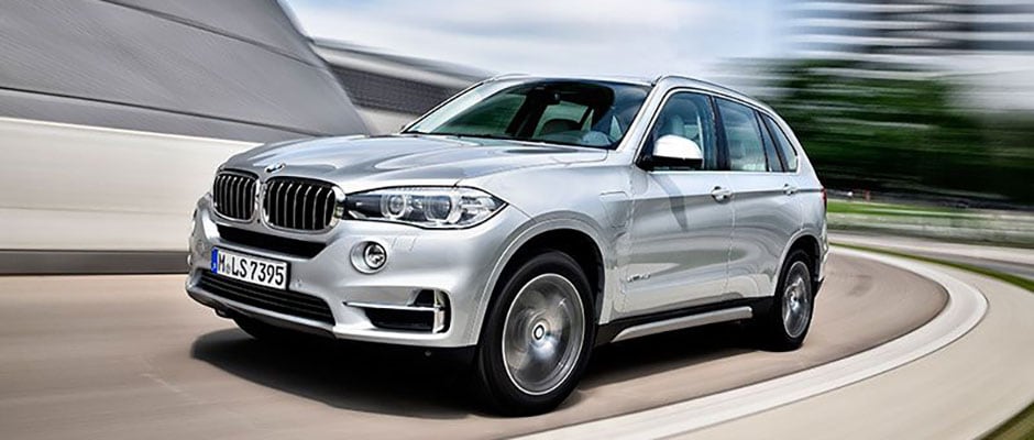 Silver 2018 BMW X5 driving