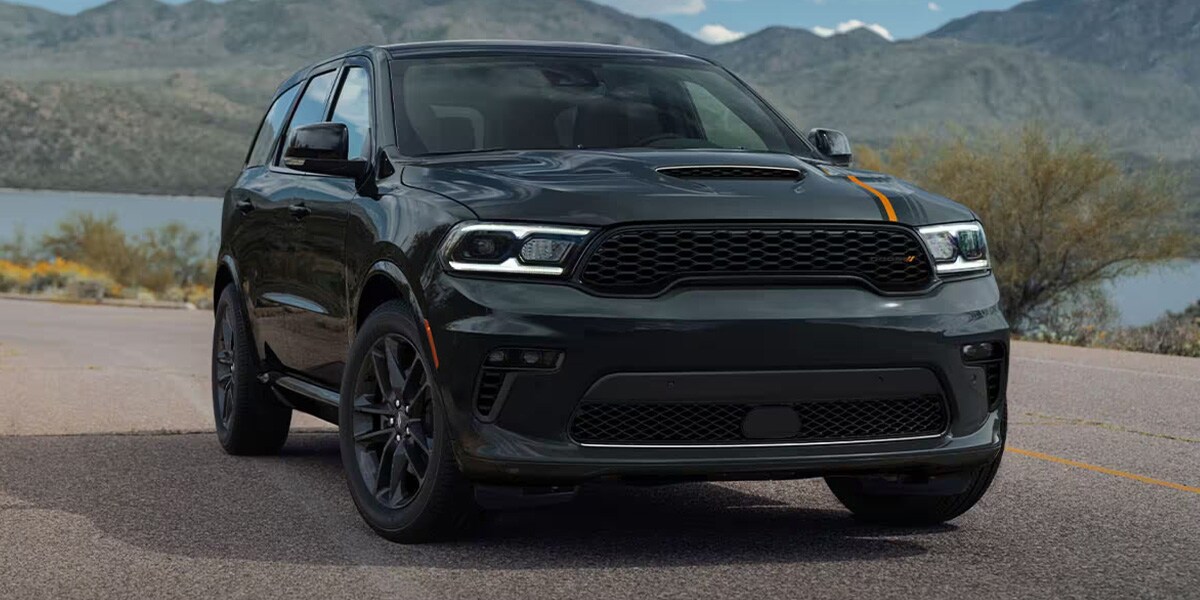 Black Dodge Durango sitting in the middle of the road