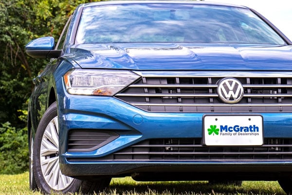2019 VW Jetta 2019 Blue VW Jetta in front of buildings