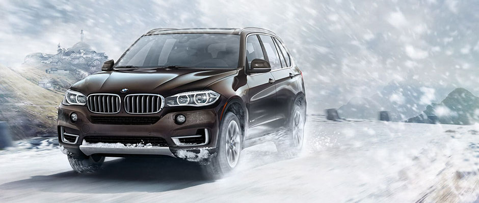 Brown 2018 BMW X5 Driving in snow