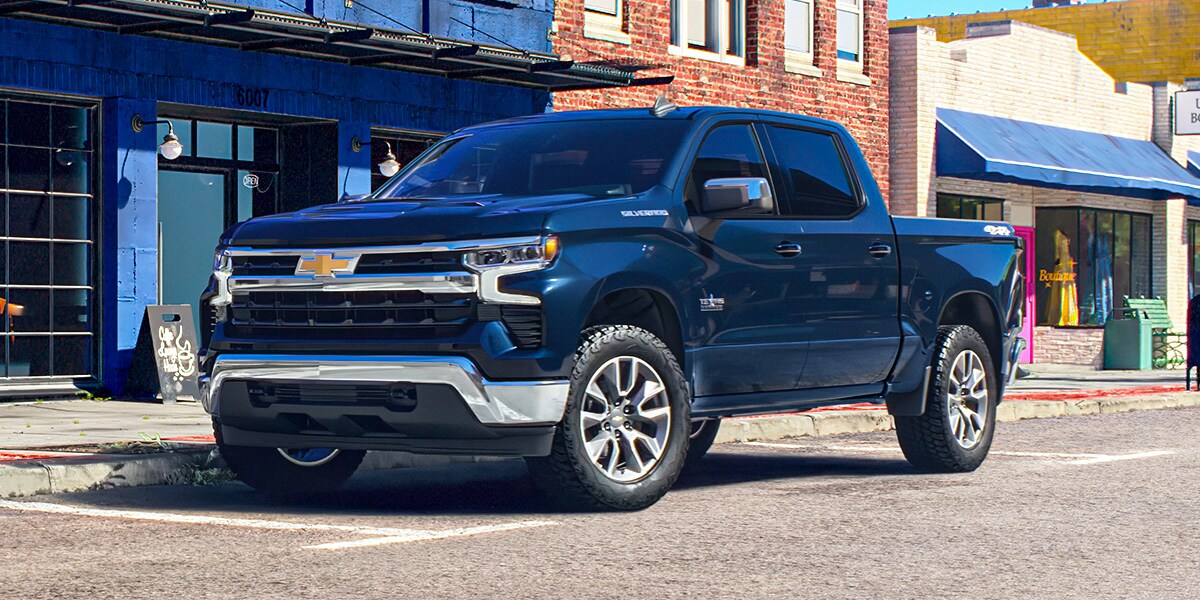 Blue Chevy Silverado 1500 parked in the street in a small midwest town