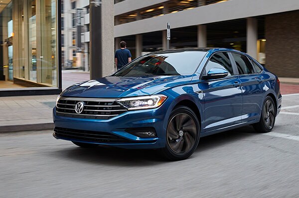 2019 VW Jetta 2019 Blue VW Jetta in front of buildings