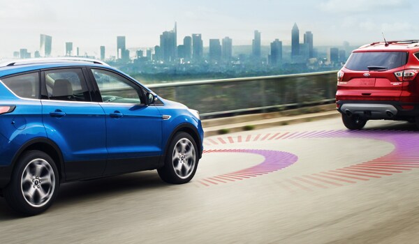 2019 Ford Escape driving down the road demonstrating adaptive cruise control