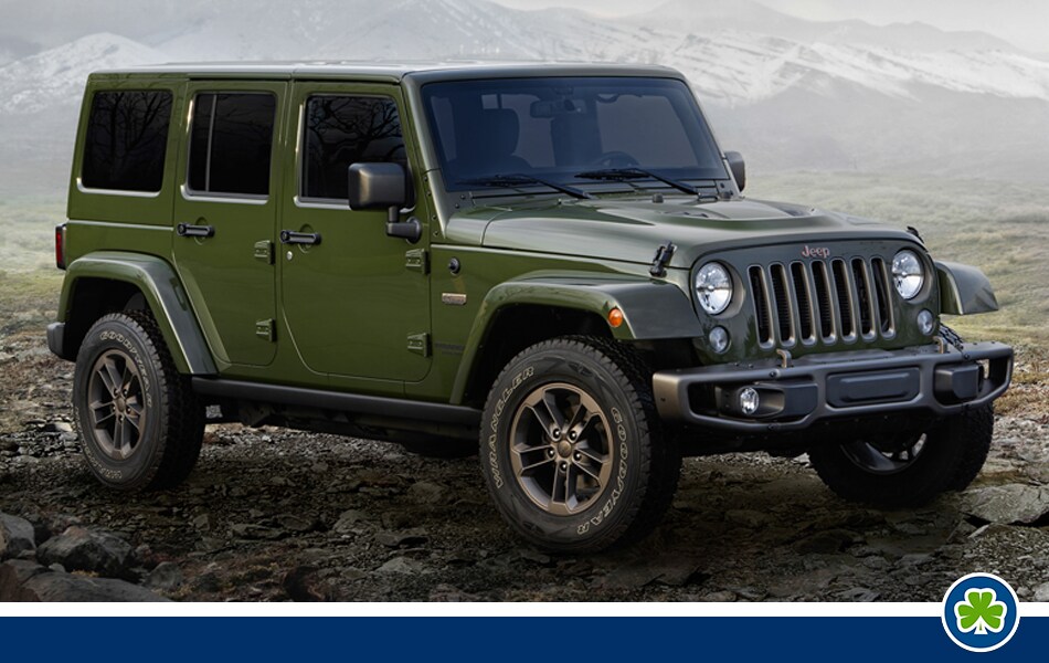 Blue 2016 Jeep Wrangler Unlimited Driving in the Snow