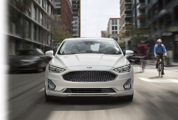 2020 Ford driving down the street