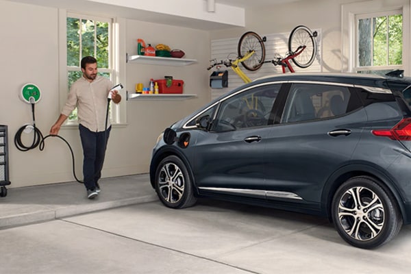 2019 Chevy Bolt in a garage charging