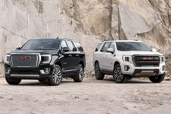 GMC Yukon parked next to rock formation