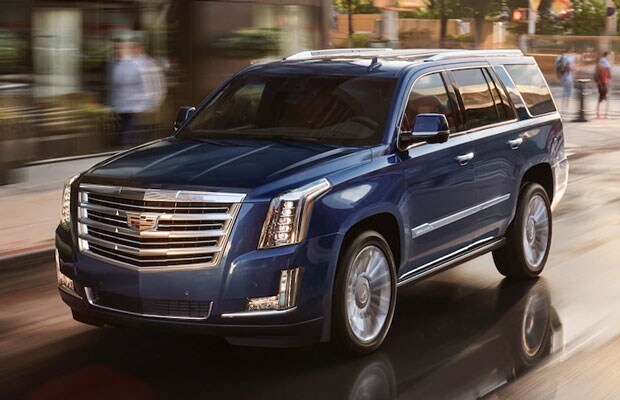2018 Cadillac Escalade driving through the city
