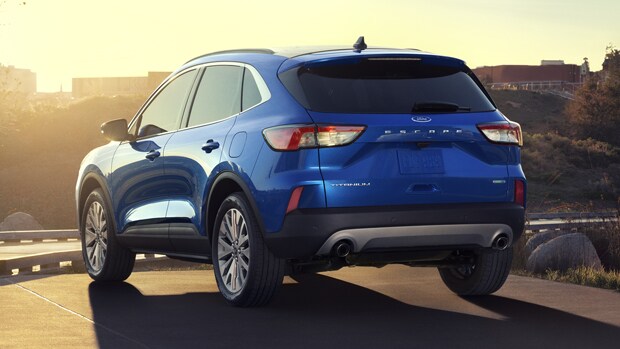 Blue Ford Escape Parked at sunset