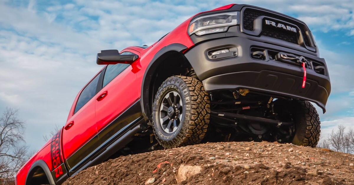 2020 red Ram 2500 Power Wagon climbing onto rocks