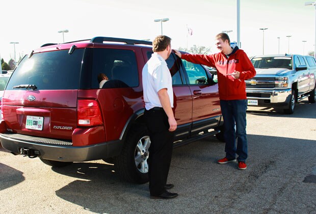 Car Salesman Helping Customer