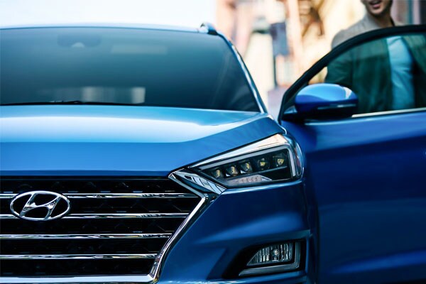 2021 Hyundai Tucson in the street with a man getting out
