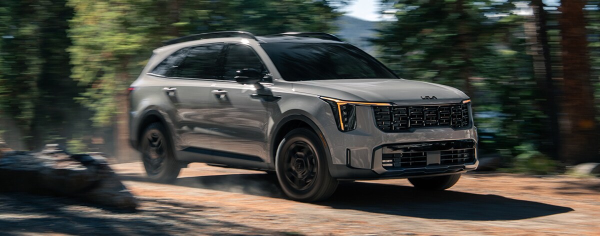 Kia sorento driving through woods