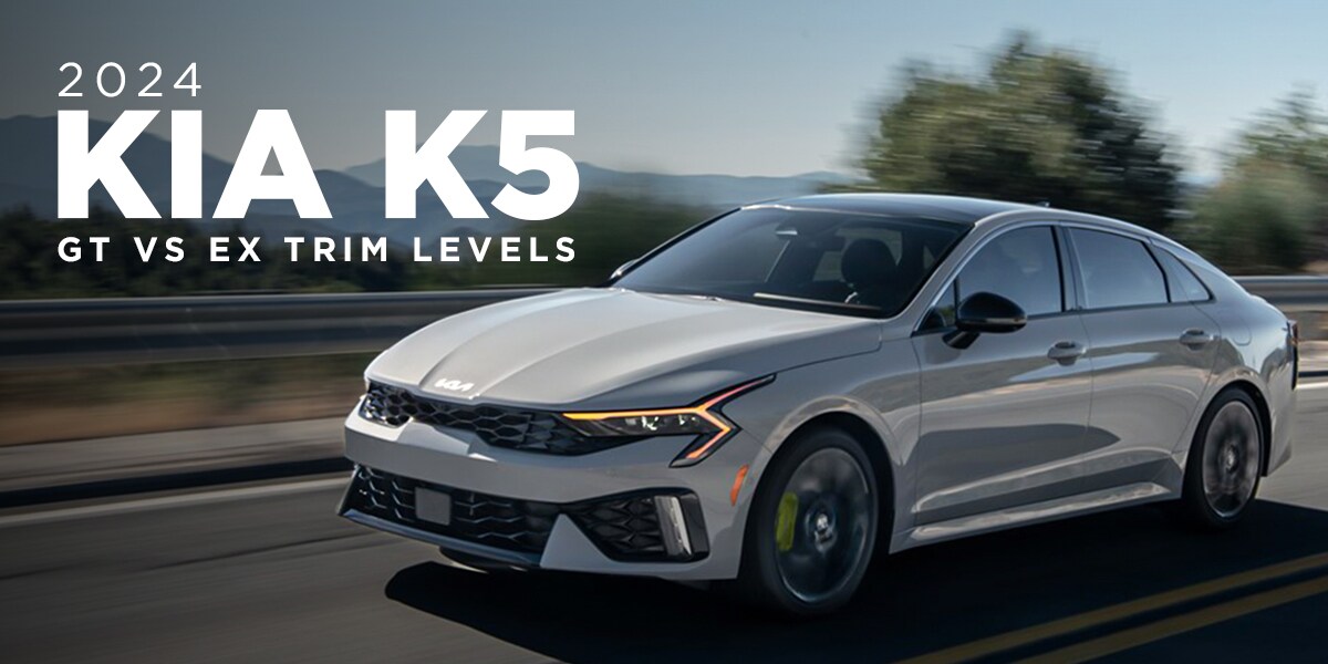 2024 Kia K5 driving down the road