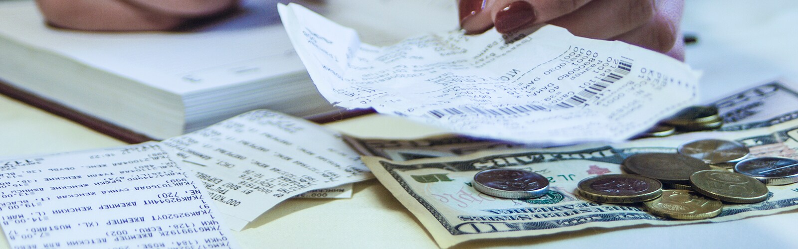 a-business-woman-calculates-the-financial-costs-an-2023-11-27-05-02-04-utc.jpg