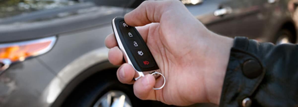Person using a Ford Key Fob to open their car