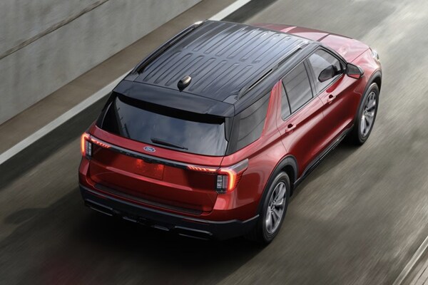 2025 Ford Explorer Rear Exterior driving down a city road