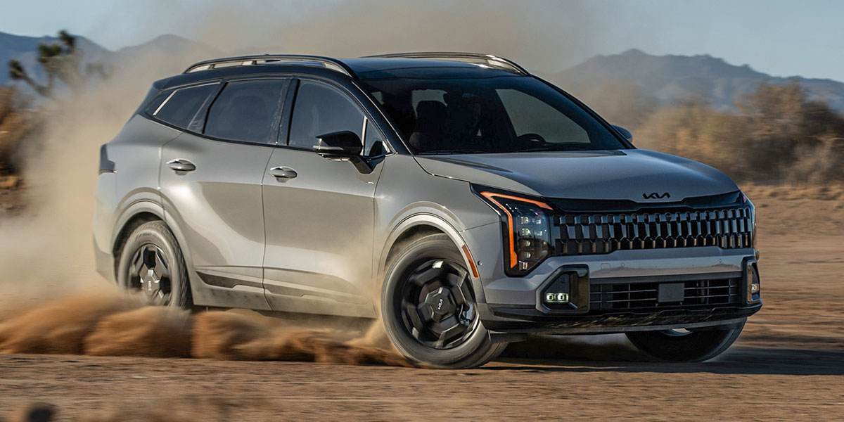 2026 Kia Sportage driving on dirt