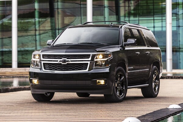 2019 Blacked Out Chevy Suburban Parked near buildings
