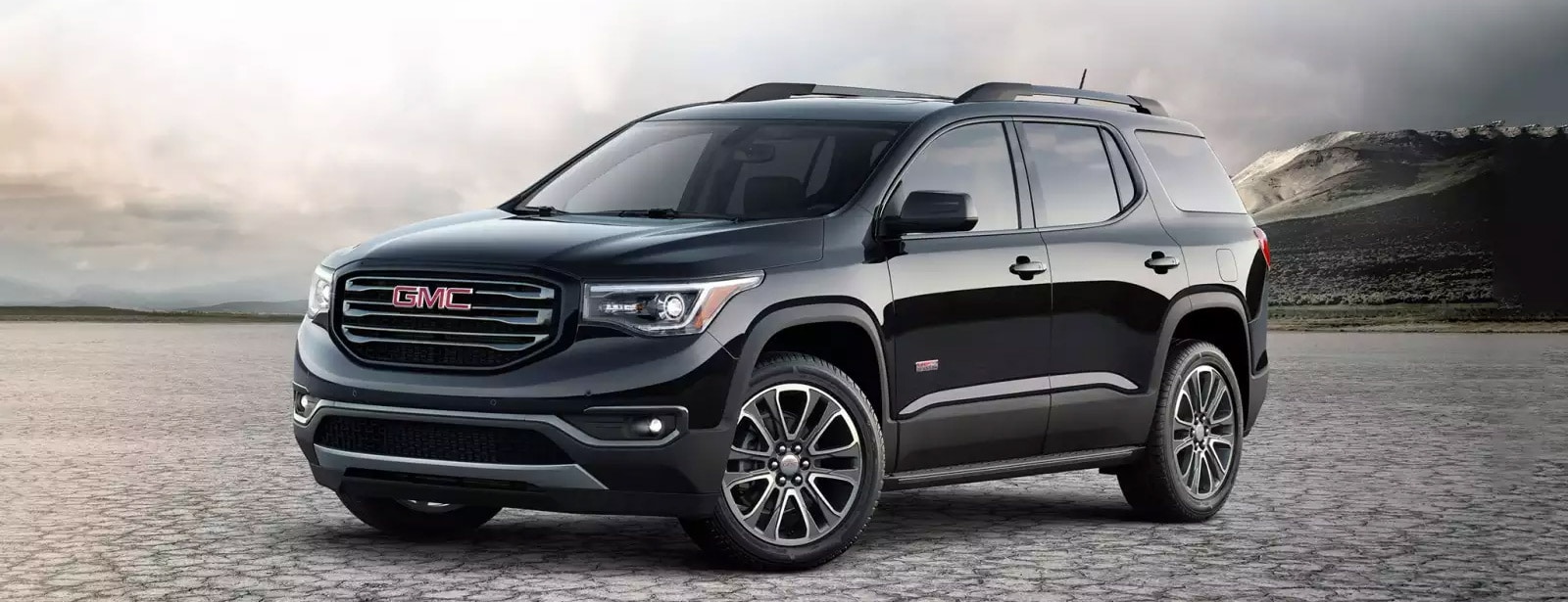 red 2018 acadia drivers side view