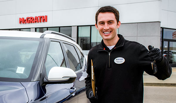 Car Salesmen taking safety precautions