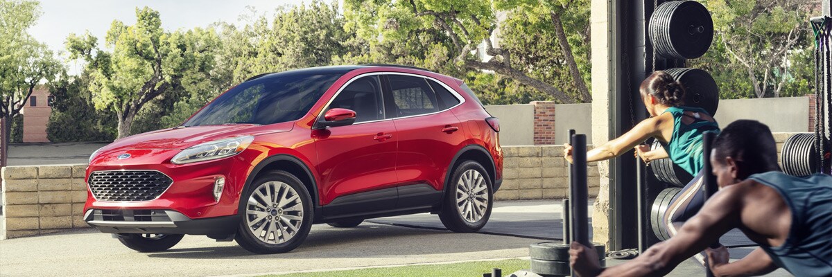 Red 2021 Ford Escape parked outside a gym