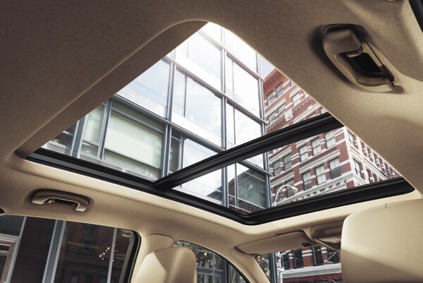 2019 Cadillac XT5 Luxury Premium UltraView Sunroof showing the city skyscrapers