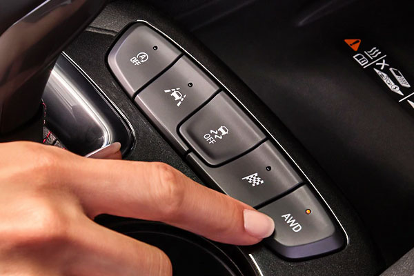 Hand pointing to AWD capabilities in the 2021 Chevy Trailblazer