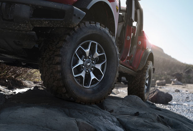 Bronco driving onver rocks