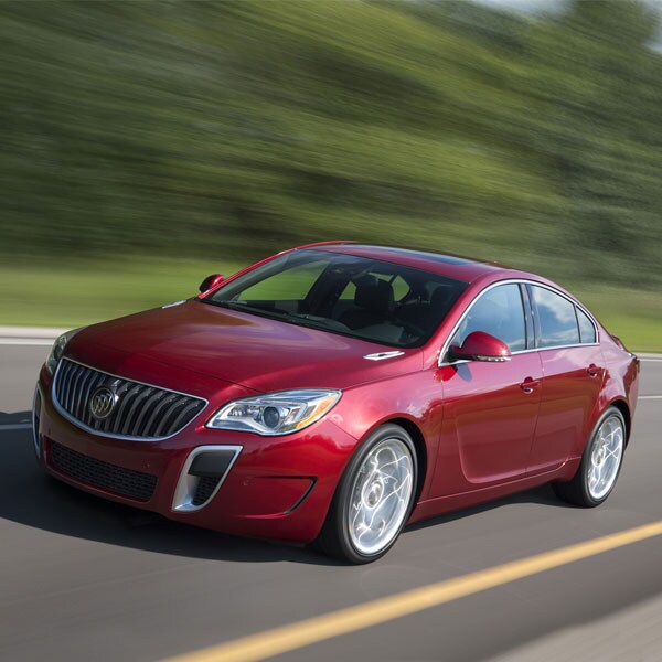 Red 2016 Buick Regal driving down the highway
