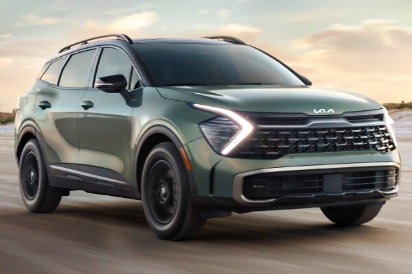 kia sportage driving down the road