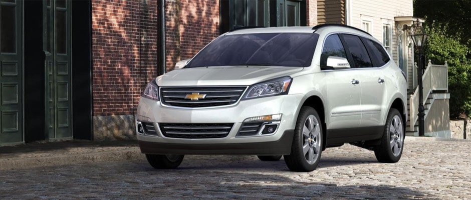 Silver Chevrolet Traverse in the city