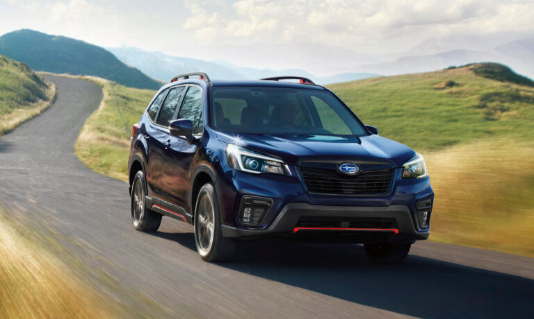2021 Subaru Forester driving through green fields
