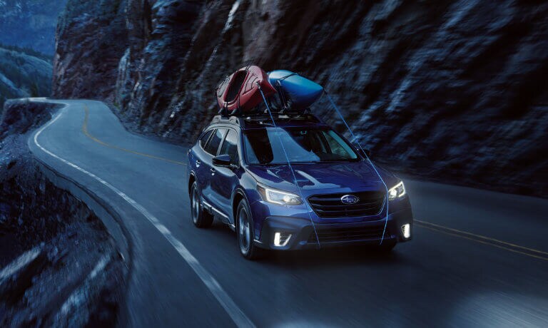 2021 Subaru Outback driving on a mountain road
