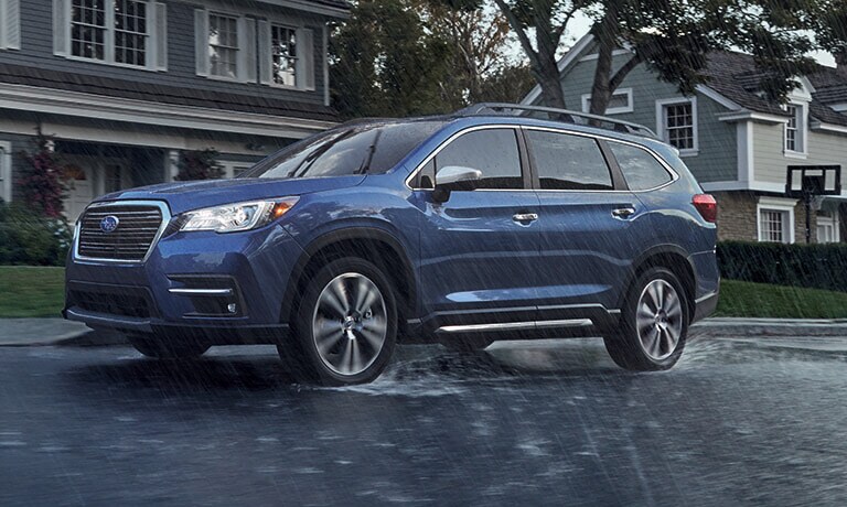 2021 Subaru Ascent parked by the curb in the rain