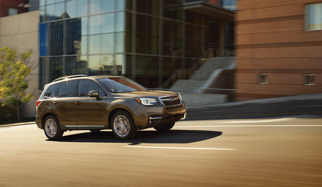 2018 Subaru Forester A brown 2018 Subaru Forester driving up a road