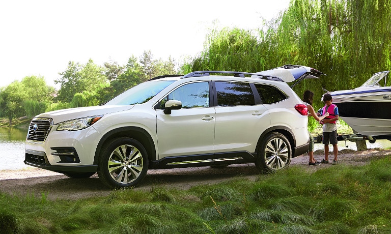 White Subaru Ascent near lake