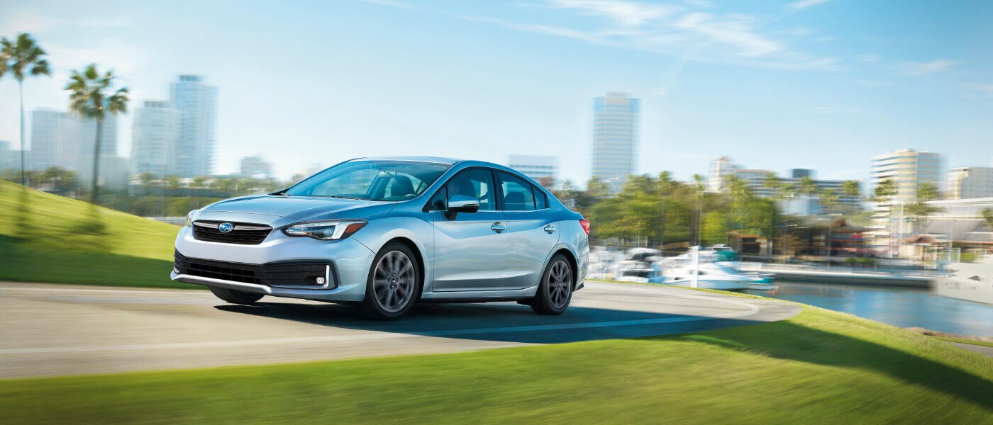 2022 Subaru Impreza driving by the docks