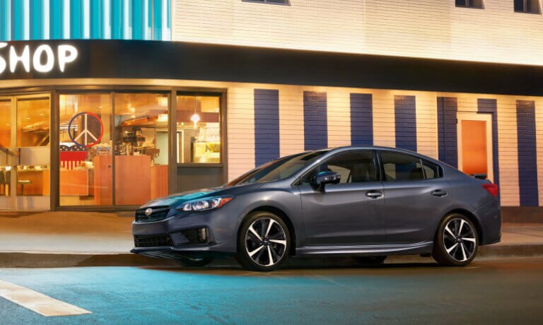 2021 Subaru Impreza parked outside of a coffee shop